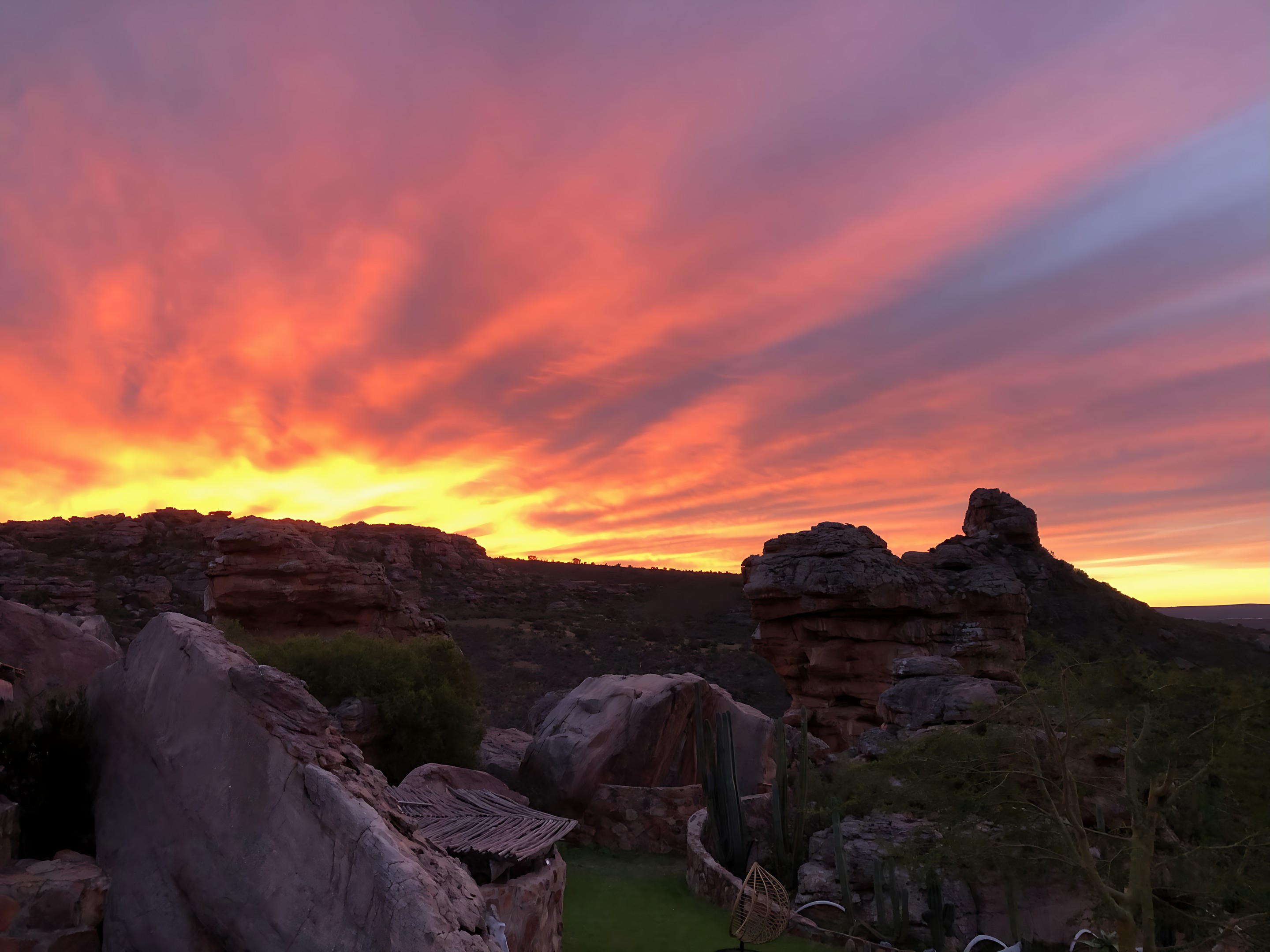 Sunset over the sandstone rocks of Diepkloof, the sky in copper and rose